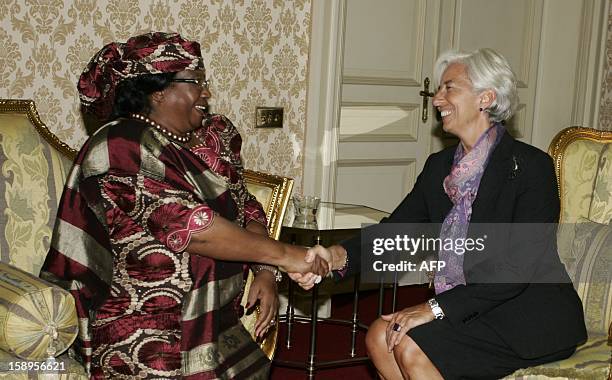 International Monetary Fund Managing Director Christine Lagarde shakes hands with Malawi’s president Joyce Banda prior to a meeting at Kamuzu Palace...