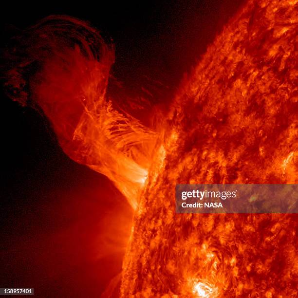 In this handout from NASA, a solar eruption rises above the surface of the sun December 31, 2012 in space. According to NASA the relatively minor...