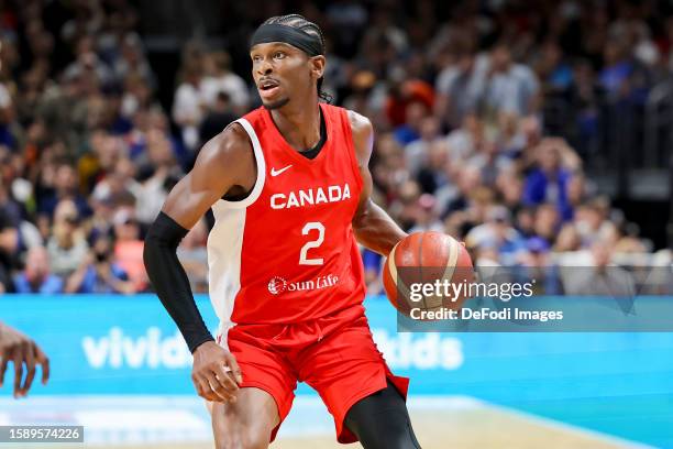 Shai Gilgeous-Alexander of Canada controls the ball during the Basketball Friendly match between Germany and Canada at Mercedes-Benz Arena on August...