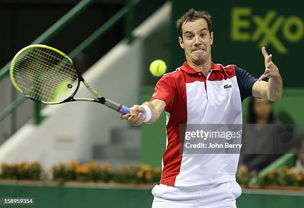 Richard Gasquet of France plays a forehand during his semi-final against Daniel Brands of Germany in day five of the Qatar Open 2013 at the Khalifa...