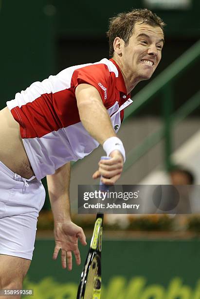 Richard Gasquet of France serves during his semi-final against Daniel Brands of Germany in day five of the Qatar Open 2013 at the Khalifa...