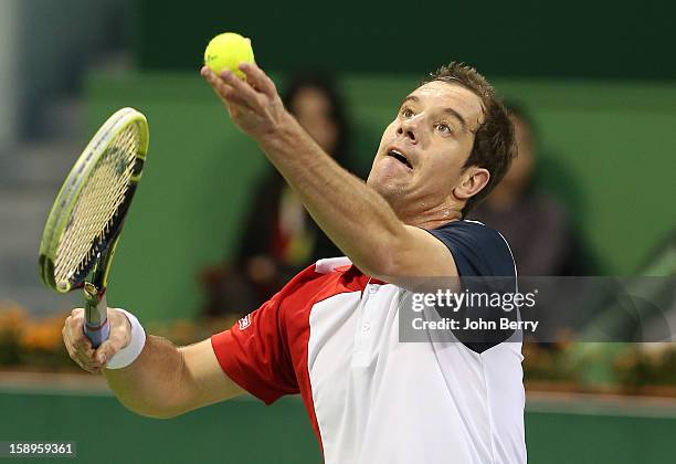 Richard Gasquet of France serves during his semi-final against Daniel Brands of Germany in day five of the Qatar Open 2013 at the Khalifa...