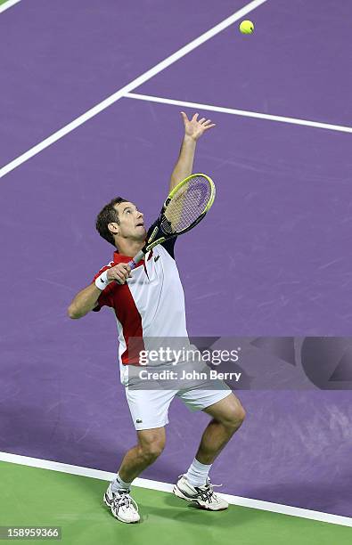 Richard Gasquet of France serves during his semi-final against Daniel Brands of Germany in day five of the Qatar Open 2013 at the Khalifa...