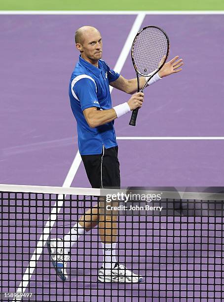 Nikolay Davydenko of Russia celebrates his victory after his semi-final against David Ferrer of Spain in day five of the Qatar Open 2013 at the...