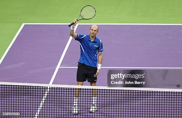 Nikolay Davydenko of Russia celebrates his victory after his semi-final against David Ferrer of Spain in day five of the Qatar Open 2013 at the...