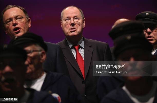 Peer Steinbrueck , chancellor candidate of the German Social Democrats , and SPD gubernatorial candidate Stephan Weil join members of an East Frisian...