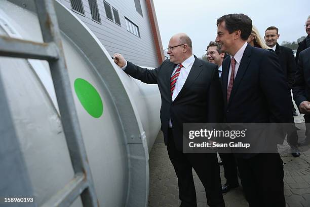 Lower Saxony Governor and incumbant candidate of the German Christian Democrats David McAllister and German Environment Minister Peter Altmaier sign...