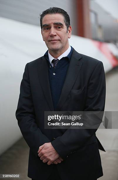 Hans-Dieter Kettwig, head of wind turbines producer Enercon, pauses outside the factory on January 4, 2013 in Aurich, Germany. Germany is investing...