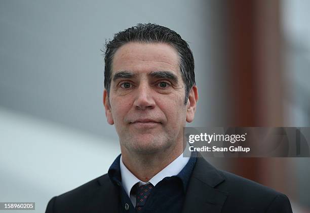 Hans-Dieter Kettwig, head of wind turbines producer Enercon, pauses outside the factory on January 4, 2013 in Aurich, Germany. Germany is investing...