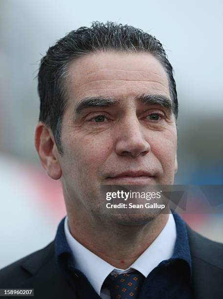 Hans-Dieter Kettwig, head of wind turbines producer Enercon, pauses outside the factory on January 4, 2013 in Aurich, Germany. Germany is investing...