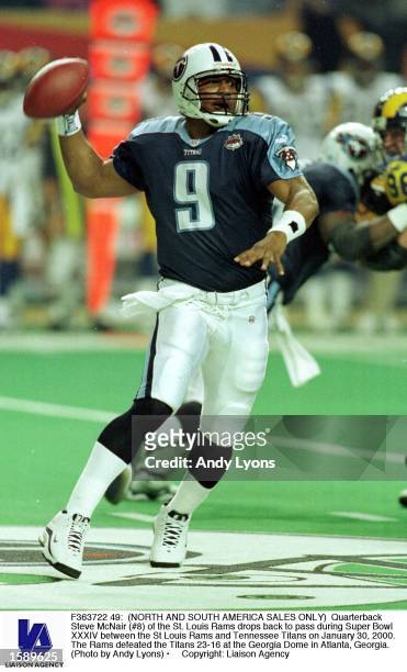 Quarterback Steve McNair of the St. Louis Rams drops back to pass during Super Bowl XXXIV between the St Louis Rams and Tennessee Titans on January...