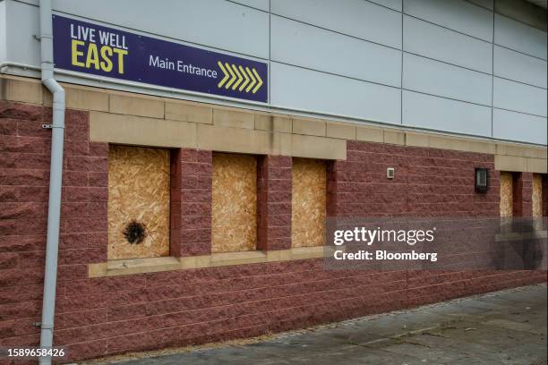 Boarded-up windows on a building neighboring the Live Well Centre, a wellbeing hub in the Berwick Hills suburb of Middlesbrough, UK, on Sunday, June...