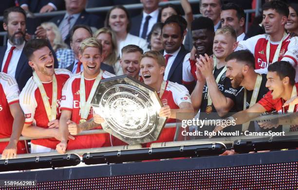 Arsenal's Martin Odegaard lifts the trophy during The FA Community Shield match between Manchester City against Arsenal at Wembley Stadium on August...