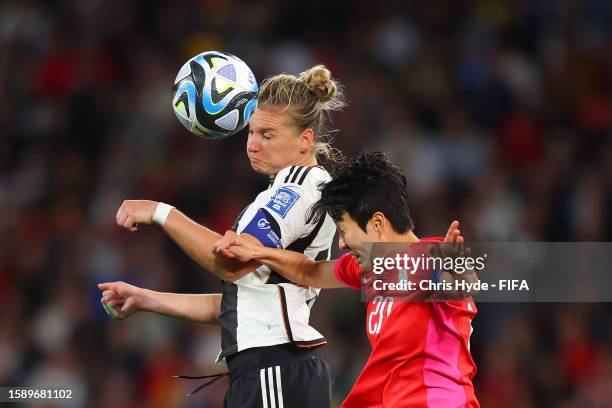 Alexandra Popp of Germany jumps for the ball with Kim Hyeri of Korea Republic during the FIFA Women's World Cup Australia & New Zealand 2023 Group H...