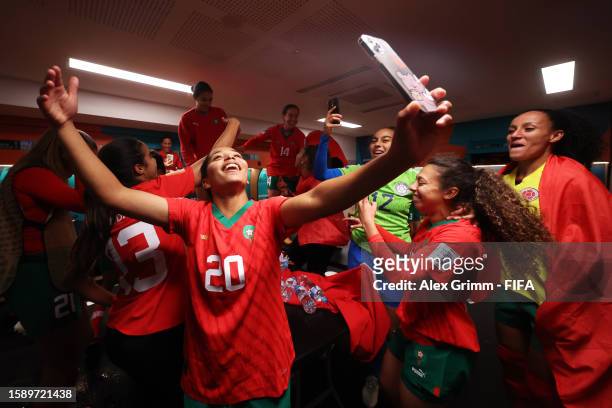 Sofia Bouftini and Morocco players celebrate advancing to the knock out stage after the 1-0 victory in the dressing room following the FIFA Women's...