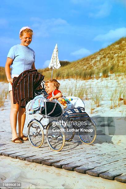 happiness of mother and child. langeoog 1963 - langeoog stock pictures, royalty-free photos & images