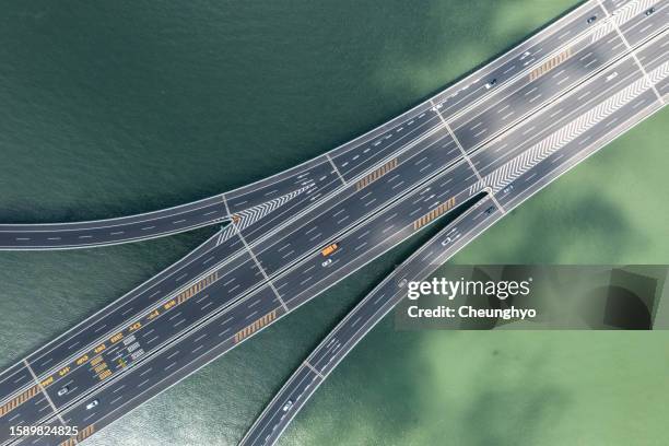 drone aerial view of jiaozhou bay bridge of qingdao, shandong province,china - jiaozhou city stock pictures, royalty-free photos & images