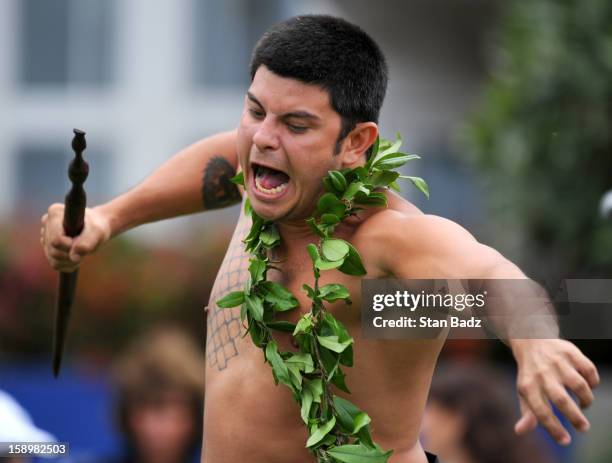 Traditional hawaiian dancer, Kamalu Eladan performs before the first round of the Hyundai Tournament of Champions at Plantation Course at Kapalua on...