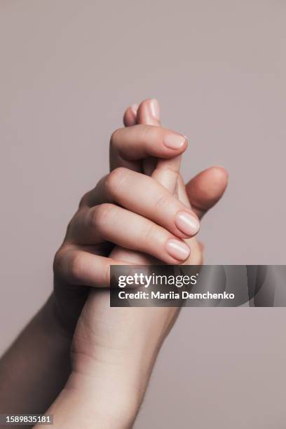 hands with beautiful manicure - pink gel nails - gel effect stock pictures, royalty-free photos & images