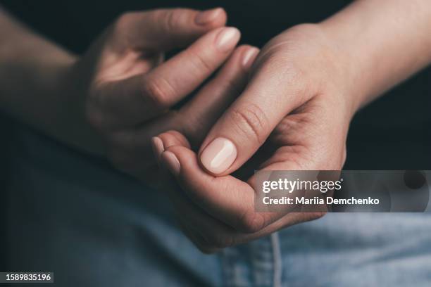 female hands with pink nude gel nails - gel nail polish stock pictures, royalty-free photos & images