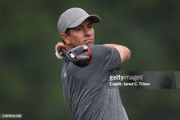 Adam Scott of Australia plays his shot from the 11th tee during the first round of the Wyndham Championship at Sedgefield Country Club on August 03,...