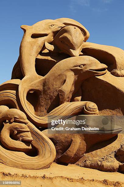 Sand sculpture entitled "Dolphin Dance" carved by Meg Murray is seen at the Under the Sea sand sculpture exhibition at the Frankston waterfront on...