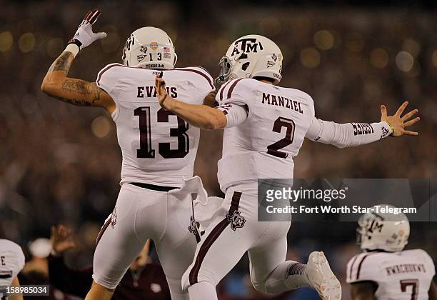 Texas A&M wide receiver Mike Evans and quarterback Johnny Manziel celebrate after Manziel's 23-yard touchdown run in the first quarter against...