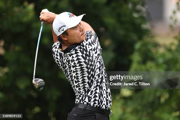 Kyoung-Hoon Lee of South Korea plays his shot from the 13th tee during the first round of the Wyndham Championship at Sedgefield Country Club on...