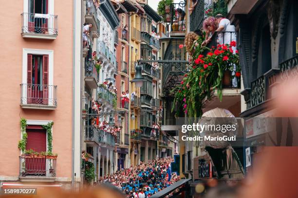 crowded street in pamplona, spain - running of the bulls stock pictures, royalty-free photos & images