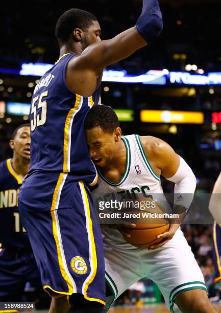Jared Sullinger of the Boston Celtics drives to the basket in front of Roy Hibbert of the Indiana Pacers during the game on January 4, 2013 at TD...