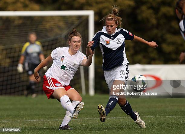 Sarah McLaughlin of Adelaide kicks the ball during the round 11 W-League match between the Melbourne Victory and Adelaide United at Wembley Park on...