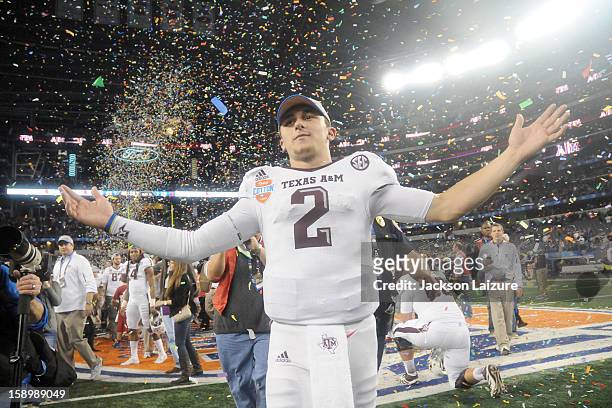 Quarterback Johnny Manziel of the Texas A&M Aggies celebrates after defeating the Oklahoma Sooners on January 4, 2012 at the Cotton Bowl at Cowboys...