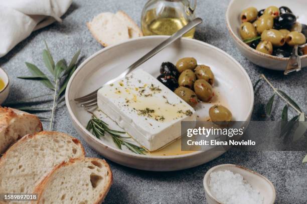 feta cheese, olives and ciabatta bread and olive oil - feta cheese stock-fotos und bilder