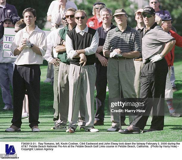 Ray Romano, left, Kevin Costner, Clint Eastwood and John Elway look down the fairway February 2, 2000 during the AT&T Pebble Beach National Pro-Am at...