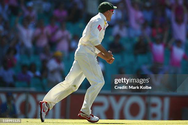 Michael Hussey of Australia celebrates catching Thilan Samaraweera of Sri Lanka during day three of the Third Test match between Australia and Sri...