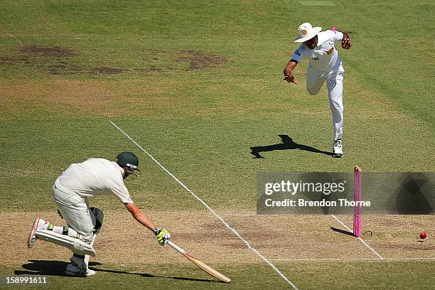 Lahiru Thirimanne of Sri Lanka attempts to run out Peter Siddle of Australia during day three of the Third Test match between Australia and Sri Lanka...