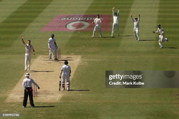 Jackson Bird of Australia sucessfully appeals for the wicket of Dimuth Karunaratne of Sri Lanka during day three of the Third Test match between...