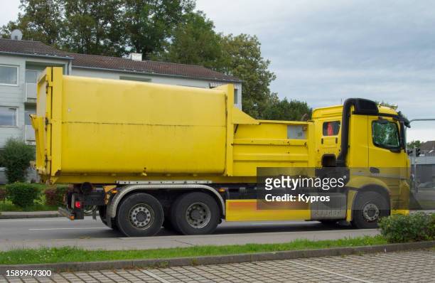 recycling collection vehicle - garbage truck driving stock pictures, royalty-free photos & images