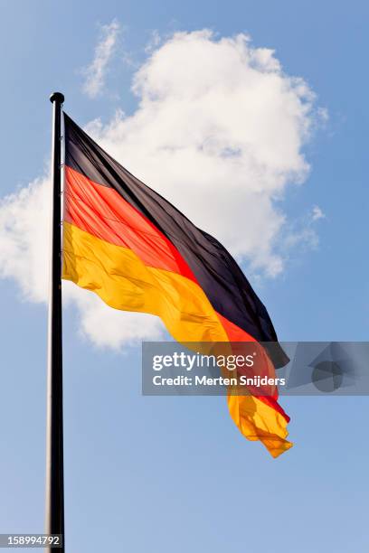 waving german flag and cloud - picture of a german flag stock pictures, royalty-free photos & images