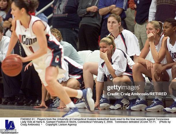 Players from the University of Connecticut Huskies basketball team react to the final seconds against Tennessee Lady Vols at Harry A. Gampel Pavilion...