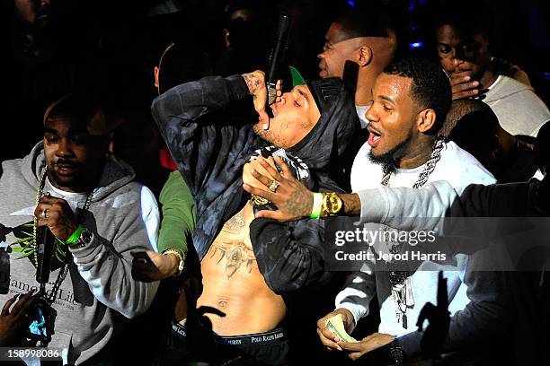 Chris Brown and The Game perform at the DGK Agenda after party at Cafe Sevilla on January 4, 2013 in Long Beach, California.