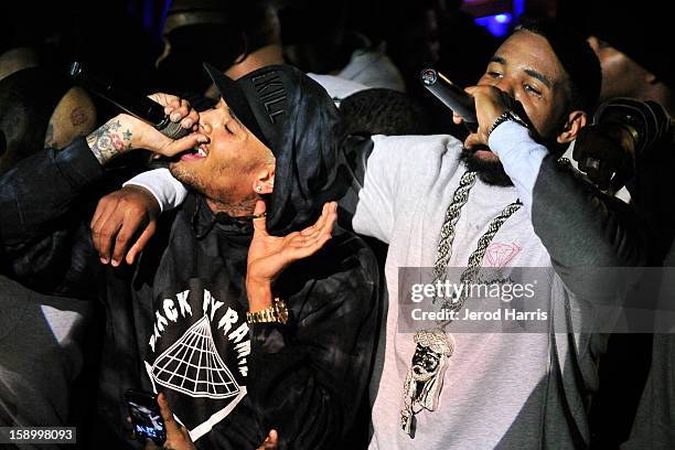 Chris Brown and The Game perform at the DGK Agenda after party at Cafe Sevilla on January 4, 2013 in Long Beach, California.