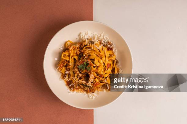 pasta bolognese fettuccine with parmesan and meat sauce - tagliatelle foto e immagini stock