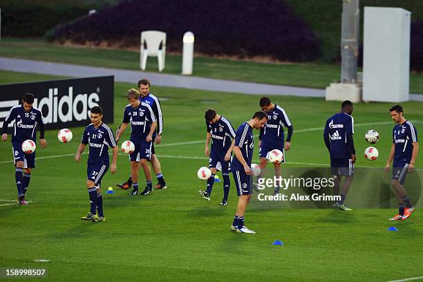 Players juggle with the ball during a Schalke 04 training session at the ASPIRE Academy for Sports Excellence on January 5, 2013 in Doha, Qatar.
