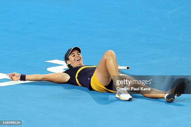Anabel Medina Garrigues of Spain celebrates winning the womens singles match against Ana Ivanovic of Serbia during day eight of the Hopman Cup at...