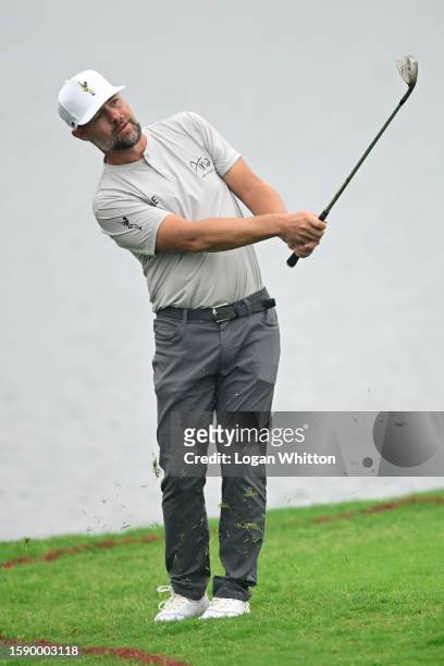 Ryan Moore of the United States plays a shot on the 15th hole during the first round of the Wyndham Championship at Sedgefield Country Club on August...