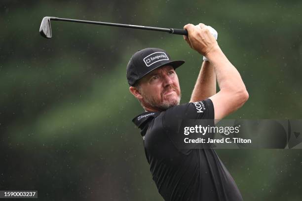 Jimmy Walker of the United States plays his shot from the 15th tee during the first round of the Wyndham Championship at Sedgefield Country Club on...