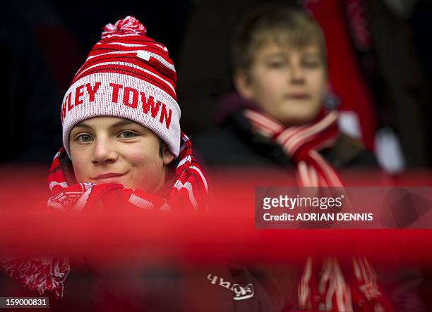 Young Crawley Town supporter looks on ahead of the English FA Cup third round football match between Crawley Town and Reading at Broadfield Stadium...