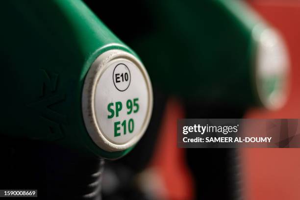 This photograph taken on August 10 shows an SP95 unleaded fuel pump at a Total Energies petrol station in Faches-Thumesnil near Lille, northern...