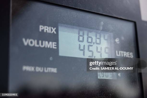 This photograph taken on August 10 shows the counter of a fuel pump at a Total Energies petrol station in Faches-Thumesnil near Lille, northern...